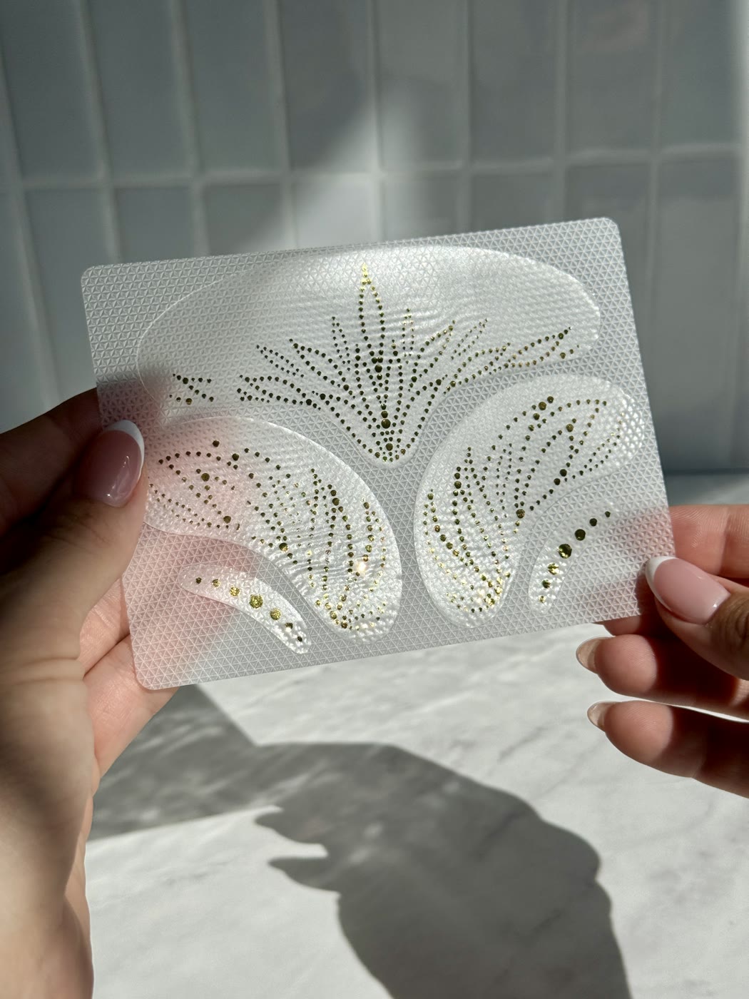 Complexion Tape sheet held in hand